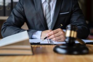 male lawyer or judge working with Law books